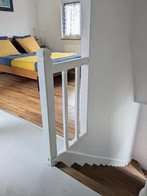 Un ou plusieurs lits dans un hébergement de l'établissement La maison bleue
