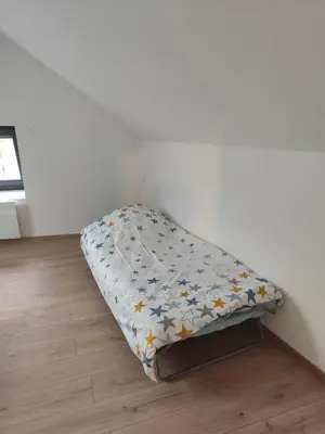 Un ou plusieurs lits dans un hébergement de l'établissement Maison cosy à Touillon