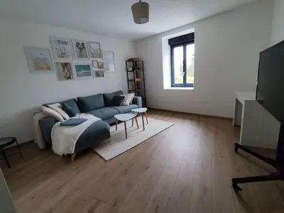 Télévision ou salle de divertissement dans l'établissement Maison cosy à Touillon