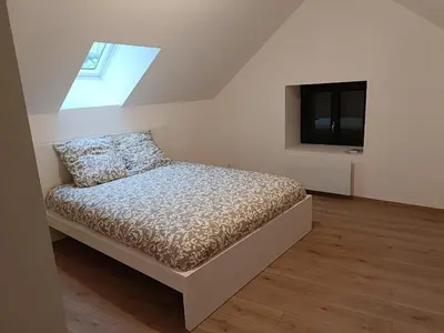 Un ou plusieurs lits dans un hébergement de l'établissement Maison cosy à Touillon