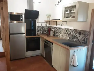 Cuisine ou kitchenette dans l'établissement Les plaines