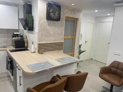 Cuisine ou kitchenette dans l'établissement Chouette Appartement 21