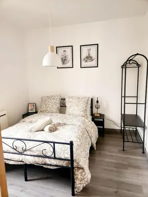 Un ou plusieurs lits dans un hébergement de l'établissement Charmant appartement au Centre-ville de Dijon