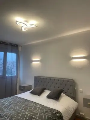 Un ou plusieurs lits dans un hébergement de l'établissement Le cosy Tournusien