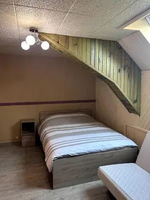 Un ou plusieurs lits dans un hébergement de l'établissement Maison Digoin