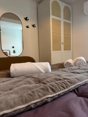 Un ou plusieurs lits dans un hébergement de l'établissement Dijon Hypercentre - Loge de la chouette