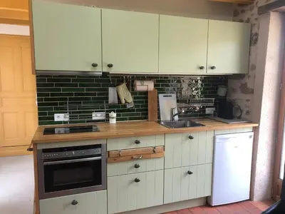 Cuisine ou kitchenette dans l'établissement La Ruisselle