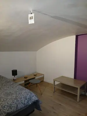 Un ou plusieurs lits dans un hébergement de l'établissement Appartement plein pied