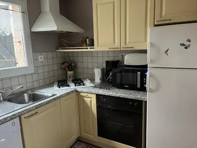 Cuisine ou kitchenette dans l'établissement Gîte Le tilleul