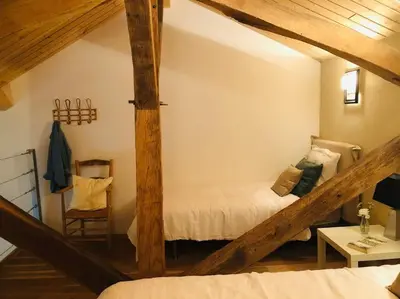 Un ou plusieurs lits dans un hébergement de l'établissement Gîte Le Clos de Miribel