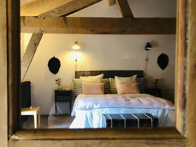 Un ou plusieurs lits dans un hébergement de l'établissement Gîte Le Clos de Miribel