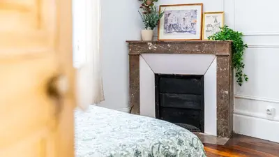 Un ou plusieurs lits dans un hébergement de l'établissement Appartement cosy avec terrasse, accès gare Dijon à pied