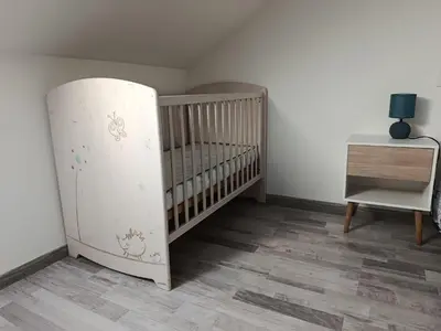 Un ou plusieurs lits dans un hébergement de l'établissement Maison de campagne