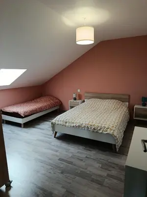 Un ou plusieurs lits dans un hébergement de l'établissement Maison de campagne
