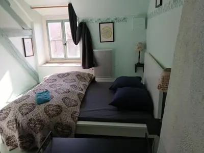 Un ou plusieurs lits dans un hébergement de l'établissement Gite de hermitage