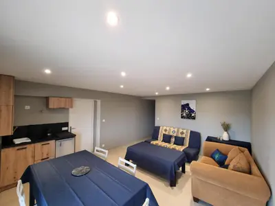 Un ou plusieurs lits dans un hébergement de l'établissement Appartement au cœur des vignes