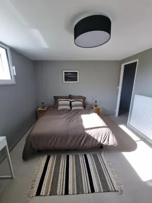 Un ou plusieurs lits dans un hébergement de l'établissement Appartement au cœur des vignes