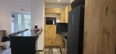 Cuisine ou kitchenette dans l'établissement Le Coup de Foudre Jardin - Spacieux