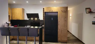 Cuisine ou kitchenette dans l'établissement Le Coup de Foudre Jardin - Spacieux