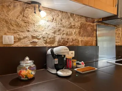 Cuisine ou kitchenette dans l'établissement Le Coup de Coeur Terrasse Calme