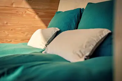 Un ou plusieurs lits dans un hébergement de l'établissement Sãmo Lodges