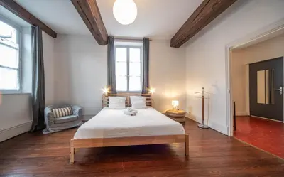Un ou plusieurs lits dans un hébergement de l'établissement L'appartement Cosy