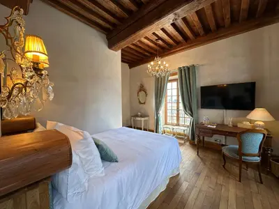 Un ou plusieurs lits dans un hébergement de l'établissement Gite, chambre d hôte L échoppe est belle