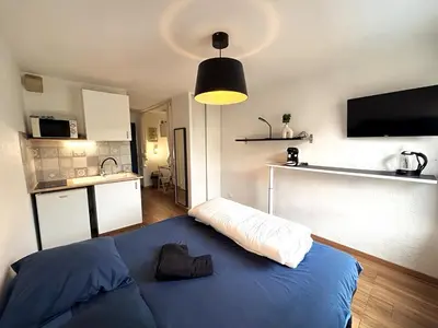 Cuisine ou kitchenette dans l'établissement Studio N210 cozy et fonctionnel