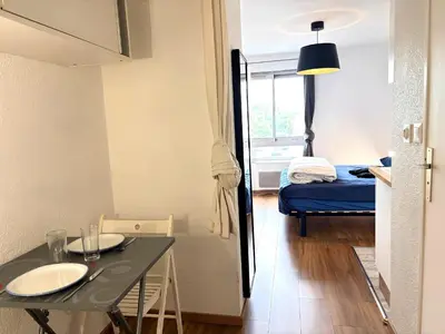 Un ou plusieurs lits dans un hébergement de l'établissement Studio N210 cozy et fonctionnel