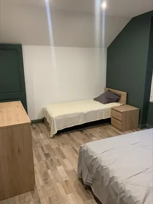 Un ou plusieurs lits dans un hébergement de l'établissement Logement au calme, à proximité de tous