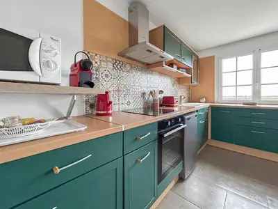 Cuisine ou kitchenette dans l'établissement T2 Au Calme Avec Jardin