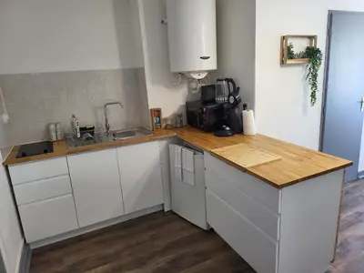 Cuisine ou kitchenette dans l'établissement Le Maupré au Coeur d'Arbois