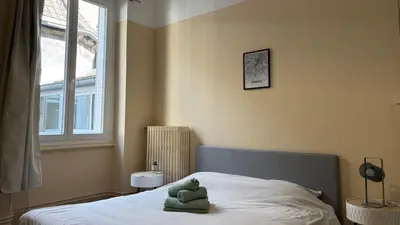 Un ou plusieurs lits dans un hébergement de l'établissement Le chat perché