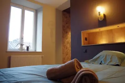 Un ou plusieurs lits dans un hébergement de l'établissement Douce Escapade à Chaintré