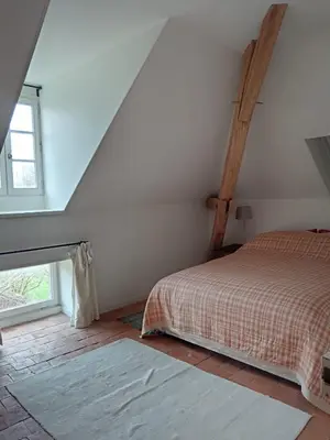 Un ou plusieurs lits dans un hébergement de l'établissement Le Clos Vert de la Chouette d'Or