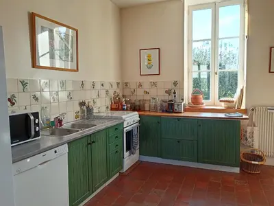 Cuisine ou kitchenette dans l'établissement Le Clos Vert de la Chouette d'Or