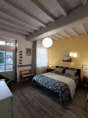 Un ou plusieurs lits dans un hébergement de l'établissement Chambre d'hôte la Chanée