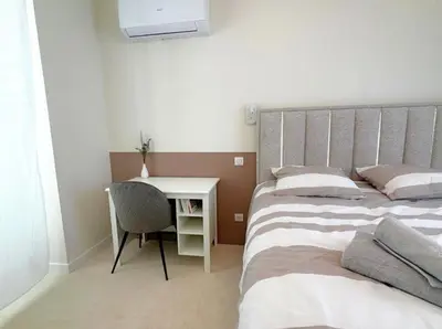 Un ou plusieurs lits dans un hébergement de l'établissement T2 haut de gamme, hyper centre, très calme, balcon, stationnements proches