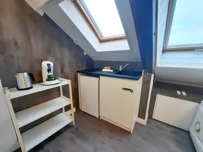 Cuisine ou kitchenette dans l'établissement L'Opale - Sauna et Jacuzzi