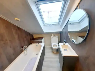 Salle de bains dans l'établissement L'Opale - Sauna et Jacuzzi