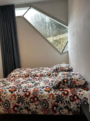 Un ou plusieurs lits dans un hébergement de l'établissement Location gîte atypique Jura