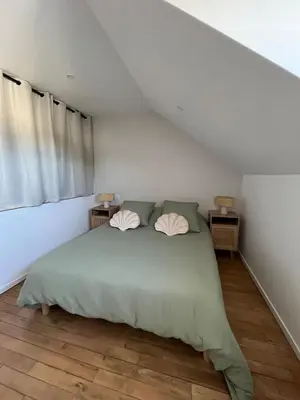 Un ou plusieurs lits dans un hébergement de l'établissement Appartement type T2 Il Giardino Sospeso