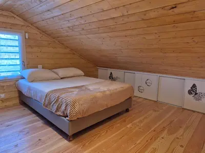 Un ou plusieurs lits dans un hébergement de l'établissement Le chalet du bord de Saône