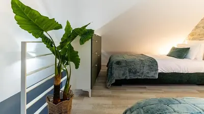 Un ou plusieurs lits dans un hébergement de l'établissement La Maison Mercier