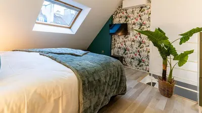 Un ou plusieurs lits dans un hébergement de l'établissement La Maison Mercier