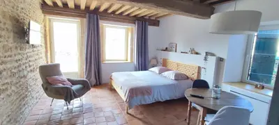 Un ou plusieurs lits dans un hébergement de l'établissement La Coquille, chambre douillette auprès d'un élevage d'escargots