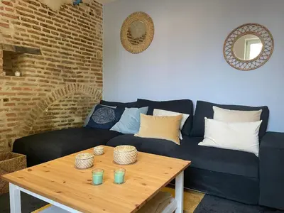 Coin salon dans l'établissement Appartement calme et chaleureux