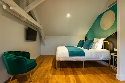 Un ou plusieurs lits dans un hébergement de l'établissement Solstice Beaune - Hôtel et Terroir