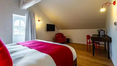 Un ou plusieurs lits dans un hébergement de l'établissement Solstice Beaune - Hôtel et Terroir