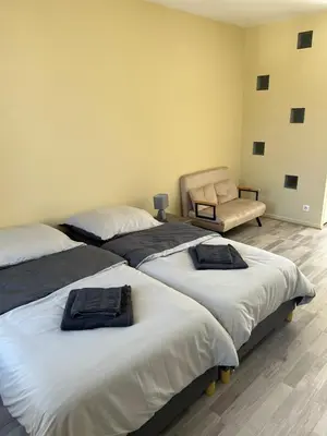 Un ou plusieurs lits dans un hébergement de l'établissement Studio le Saint Cosme